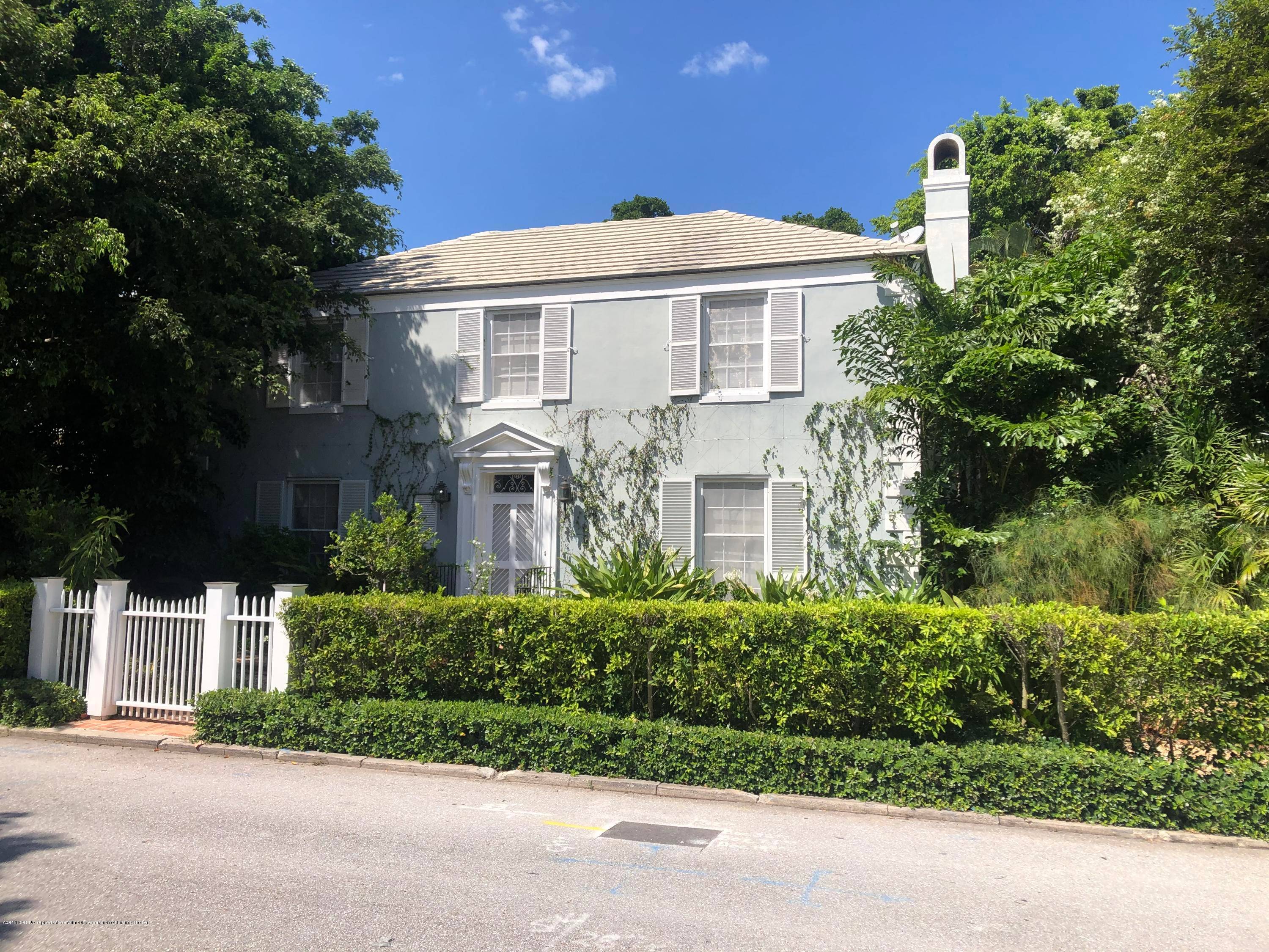 Lovely traditional Palm Beach home with timeless appeal.