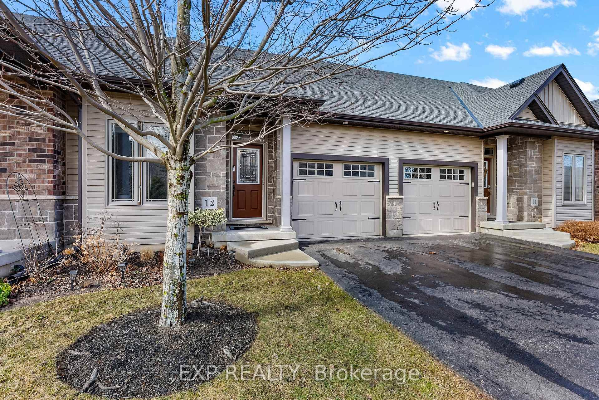 Welcome to this charming 2 bedroom bungalow style condo townhouse, where vaulted ceilings add a sense of space and character to the warm, inviting interior.