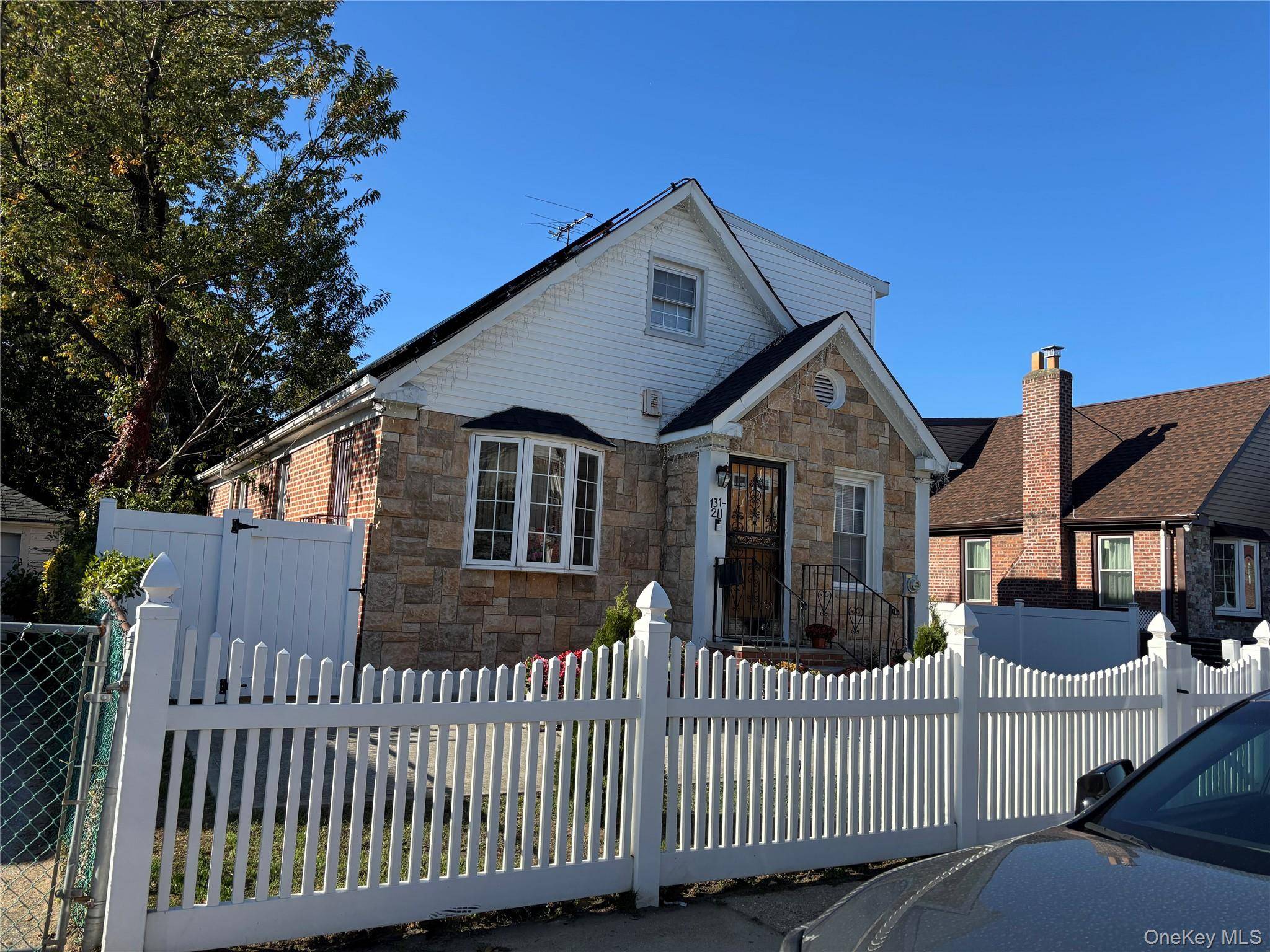 Charming Brick expanded cape sitting on 5200 square foot lot in lovely Laurelton offering 4 bedrooms, 3 bath, full finished basement, vaulted living room ceilings with beams.