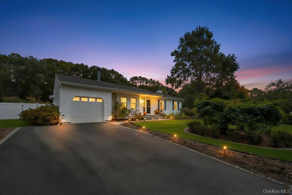 Manorville ranch with 3 bedrooms and 2 full bathrooms, just three houses from a cul de sac and backing the Long Island Pine Barrens for added privacy.