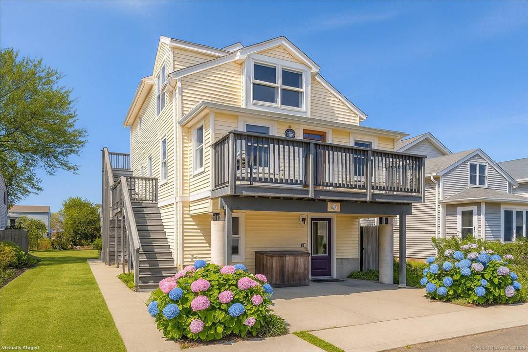 A home that redefines coastal living in Milford's coveted Point Beach enclave.