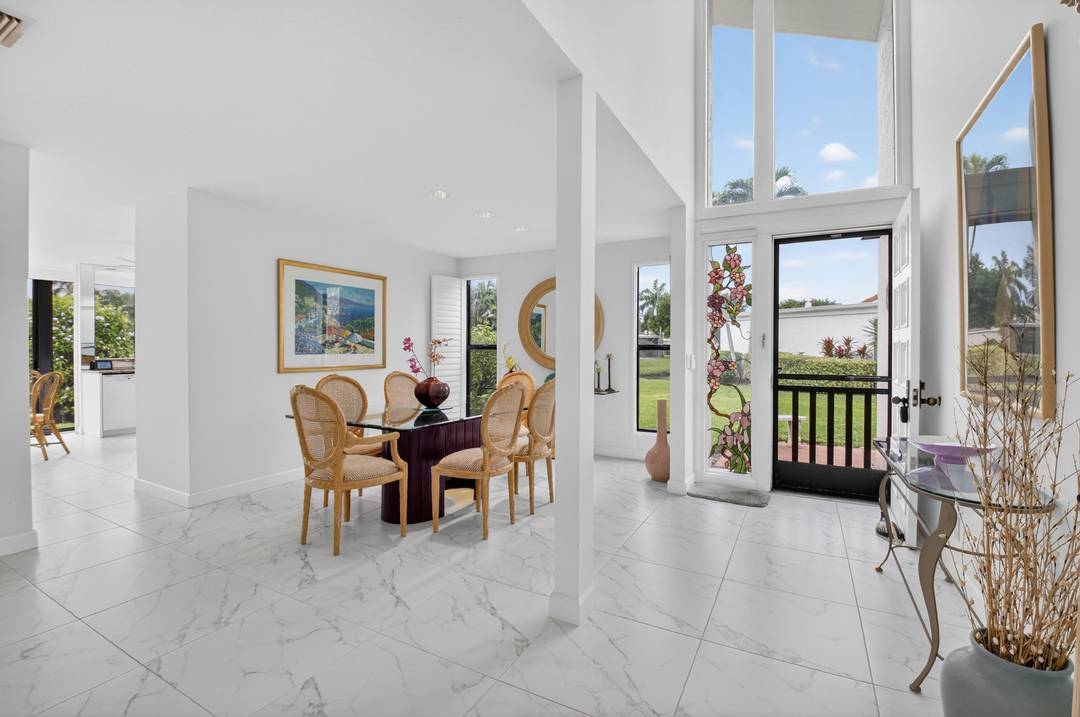 Enjoy spectacular lake and golf course views with a coveted Southeast exposure overlooking the Palmer III golf course at Boca West Country Club.