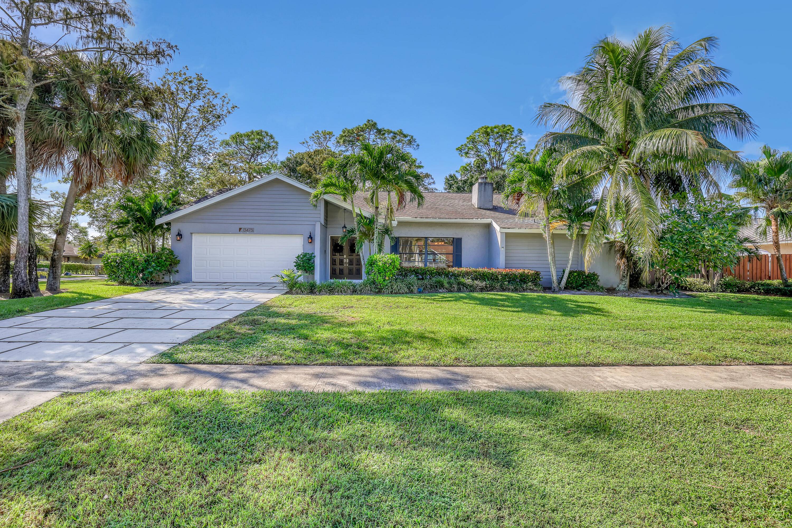 On a beautiful corner lot, This home, located in the highly desirable Pinewood Grove estates, is convenient to Wellington Equestrian activities, dining, shopping and all that Wellington has to offer.
