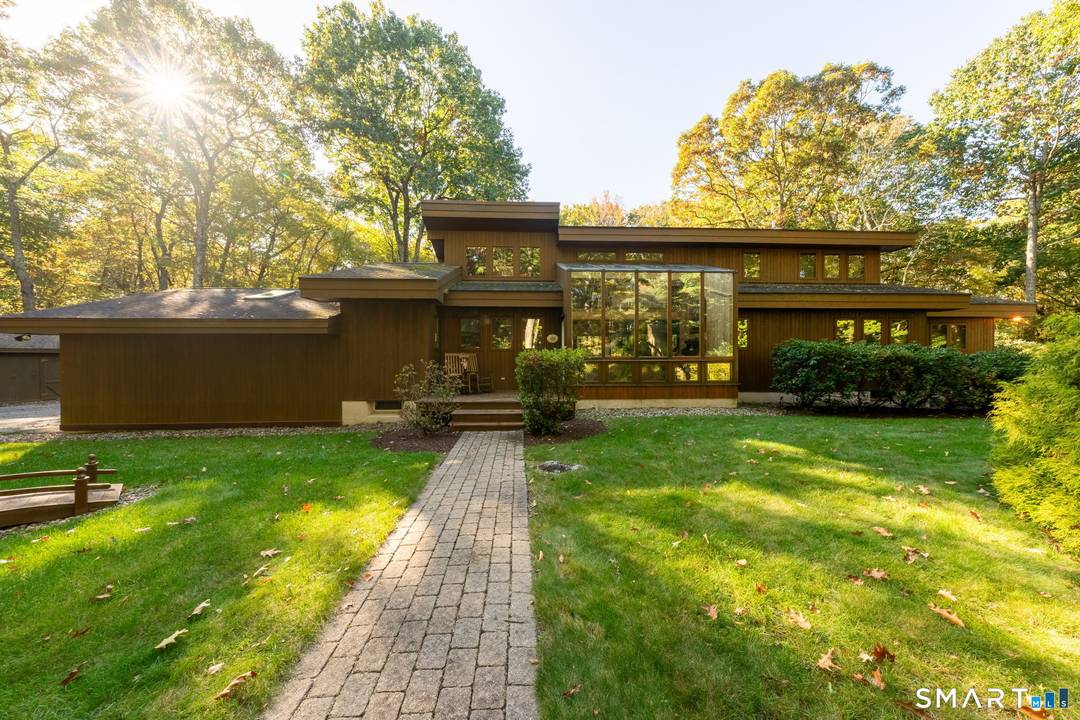 Spacious Lindal Cedar contemporary set on over 20 acres offering complete privacy and a serene nature filled setting.