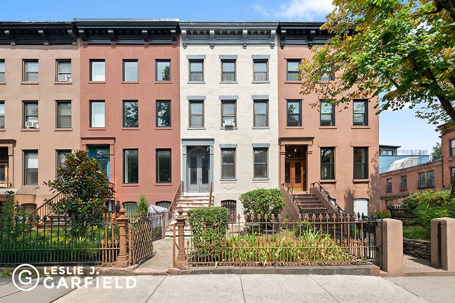 411 Union Street is a charming four family townhouse located on a picturesque tree lined street in the heart of Carroll Gardens.