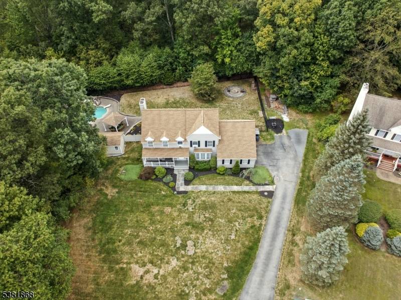 Spacious Colonial featuring a welcoming lemonade front porch and meticulously maintained landscaping and a new roof.