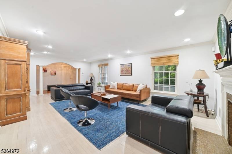 Beautifully maintained and expanded brick front custom split located in the desirable Poets Section, just two blocks from Hartshorn School.