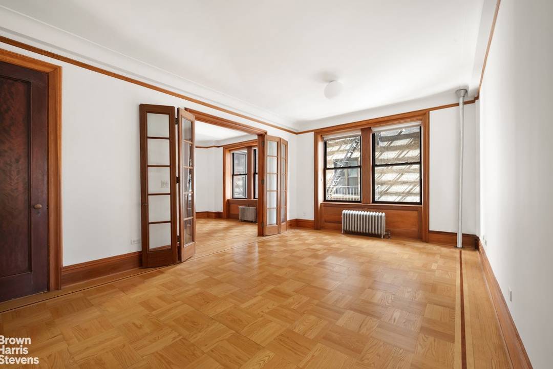 Classic prewar roomy 3 bedroom apartment, with oak floors, French doors, separate regal dining room, numerous deep closets, and direct south and east exposures,.