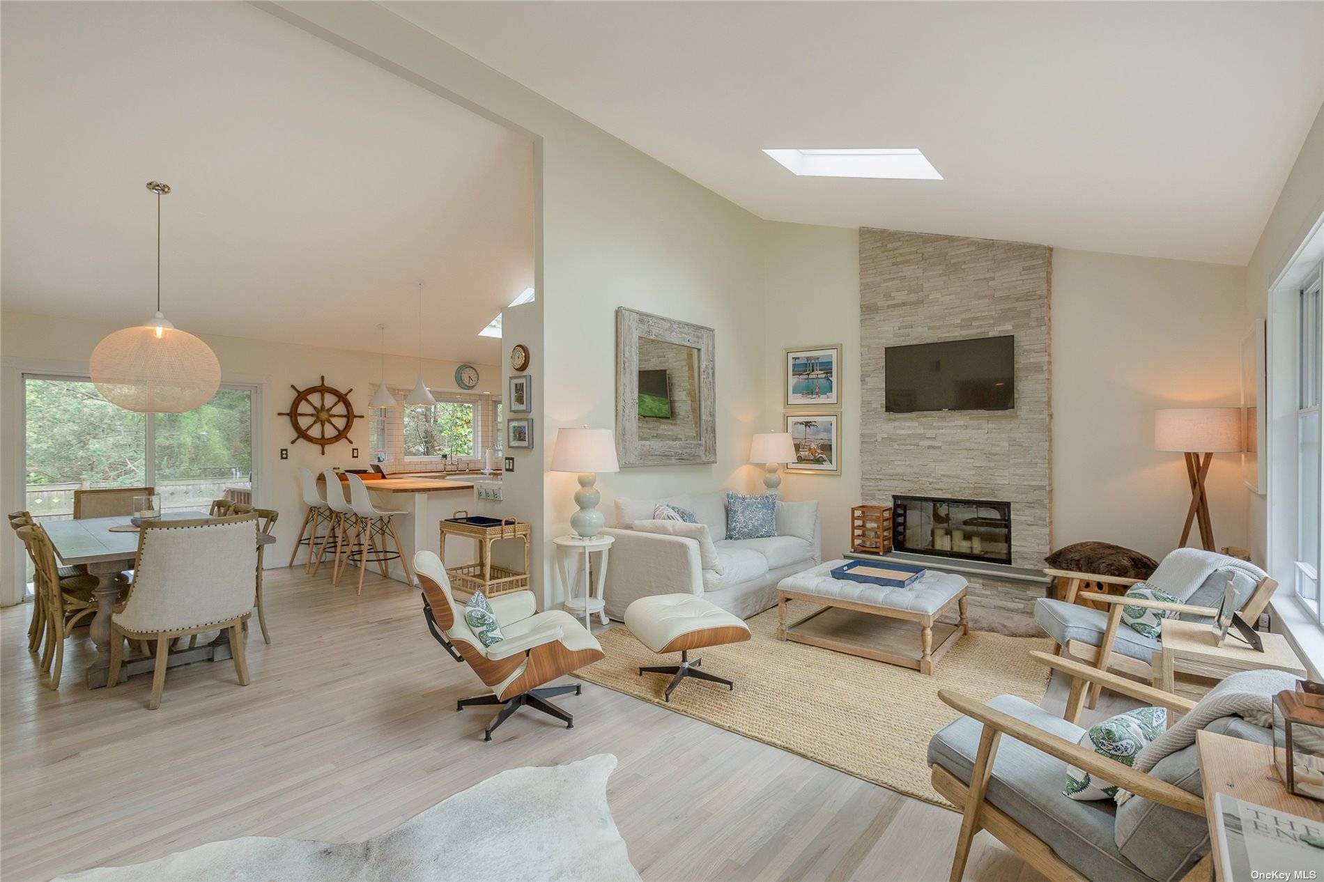 Down a long private driveway sits this secluded and charming newly listed Westhampton Beach Village Summer rental home that has been completely renovated with a Contemporary flair and style.