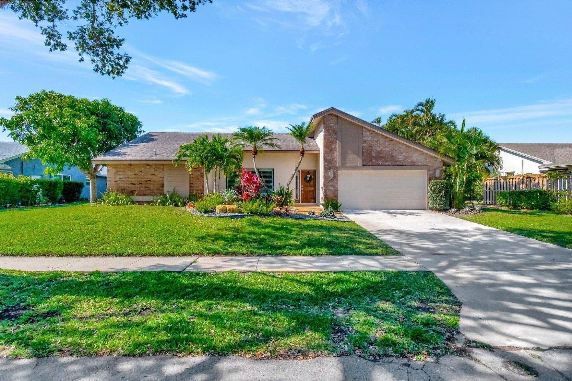 Welcome home to Central Boca in the desirable Strathmore neighborhood !