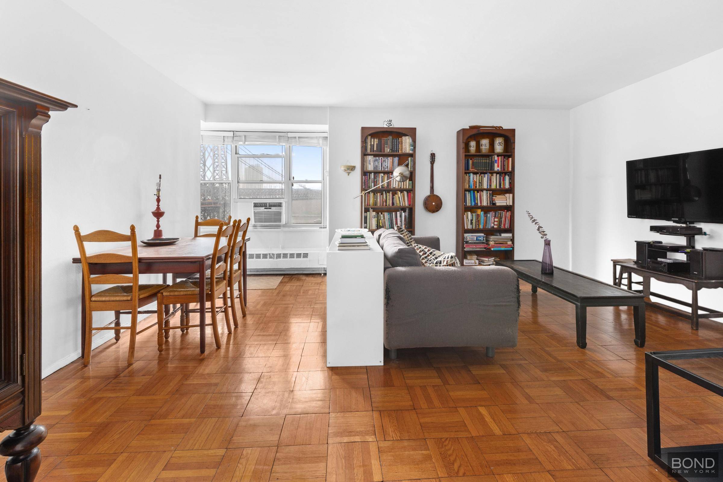 Stunning views of the Williamsburg Bridge from several windows in this large 800 square foot one bedroom sanctuary in The East River coop.