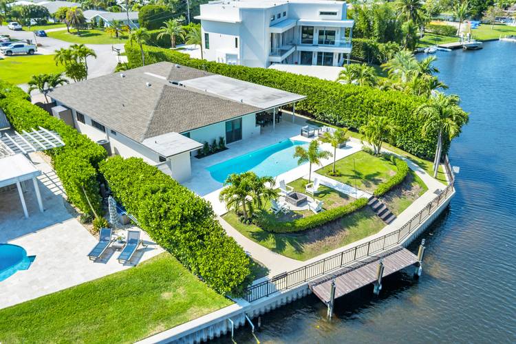 One of a Kind Waterfront Retreat in Lake Clarke Shores Fully Renovated March 2026 Discover the perfect blend of privacy, comfort, and South Florida living in this beautifully upgraded 4 ...
