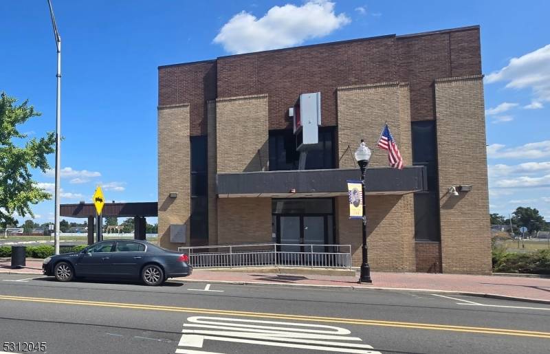 Large Former Bank Of America, still has the available safes, large 24 space parking lot, multiple drive thru windows.