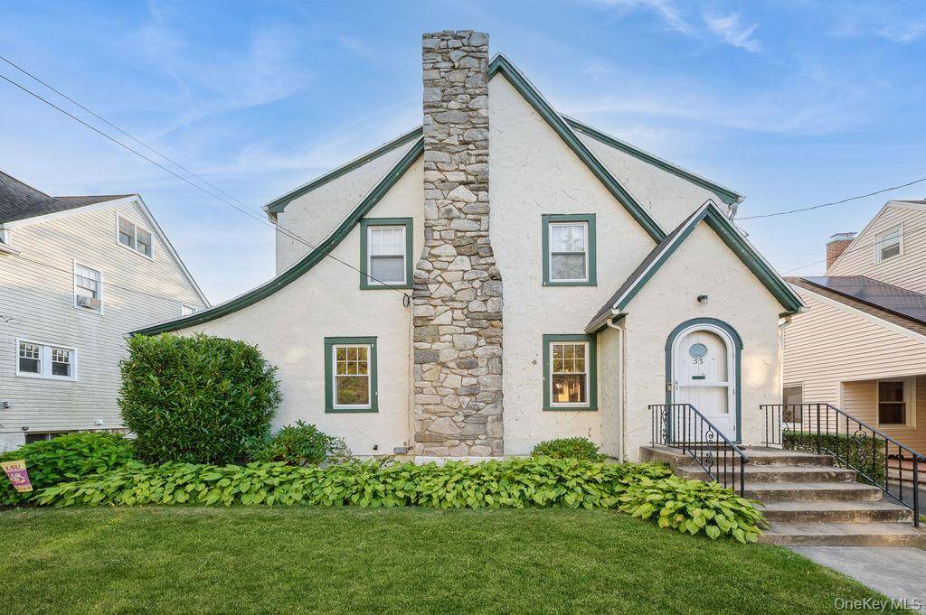 Welcome to this beautifully updated Tudor style home in the heart of White Plains, where timeless elegance meets modern convenience.