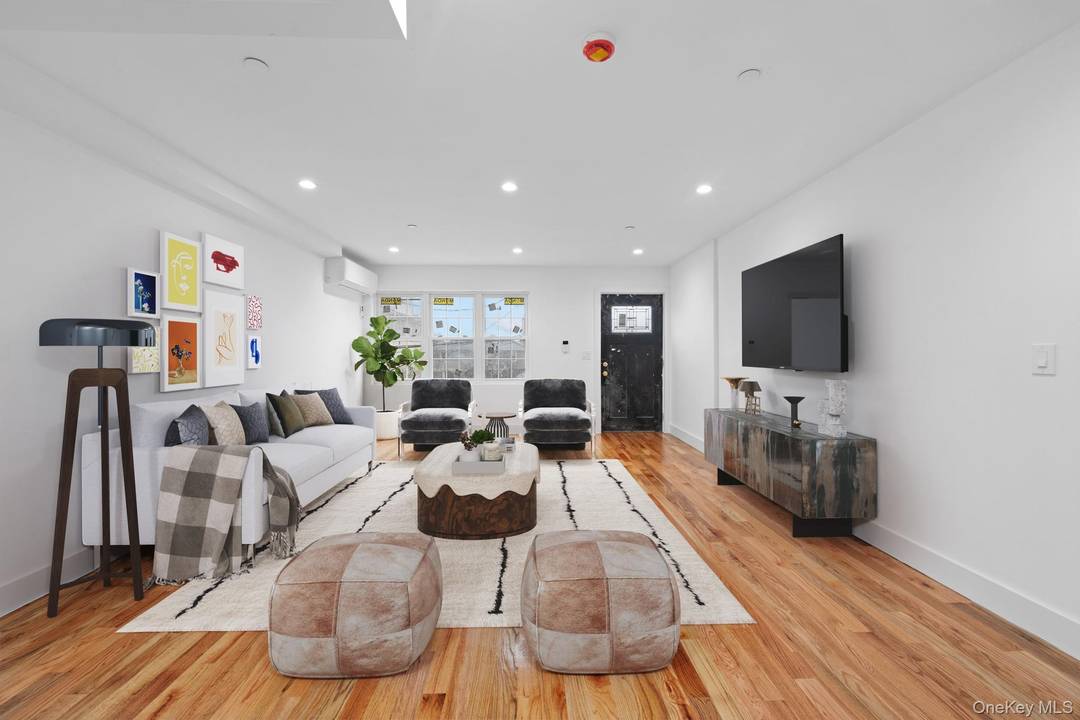 69 50 Hessler Avenue is a custom built BRAND NEW CONSTRUCTION two family nestled on a beautiful tree lined street of Far Rockaway with water views and stones throw to ...