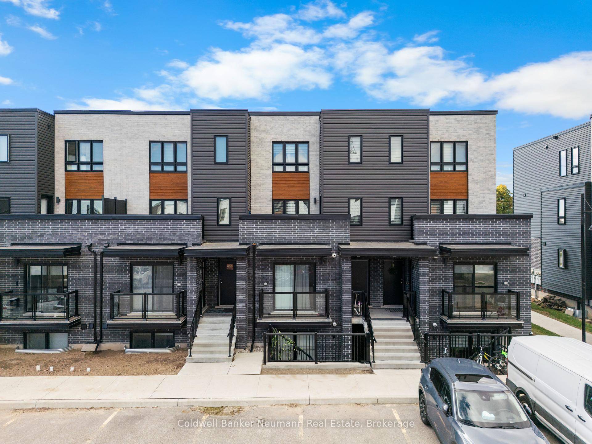 Welcome to 235 Chapel Hill Drive 23, a modern stacked townhome in the sought after Doon South community.
