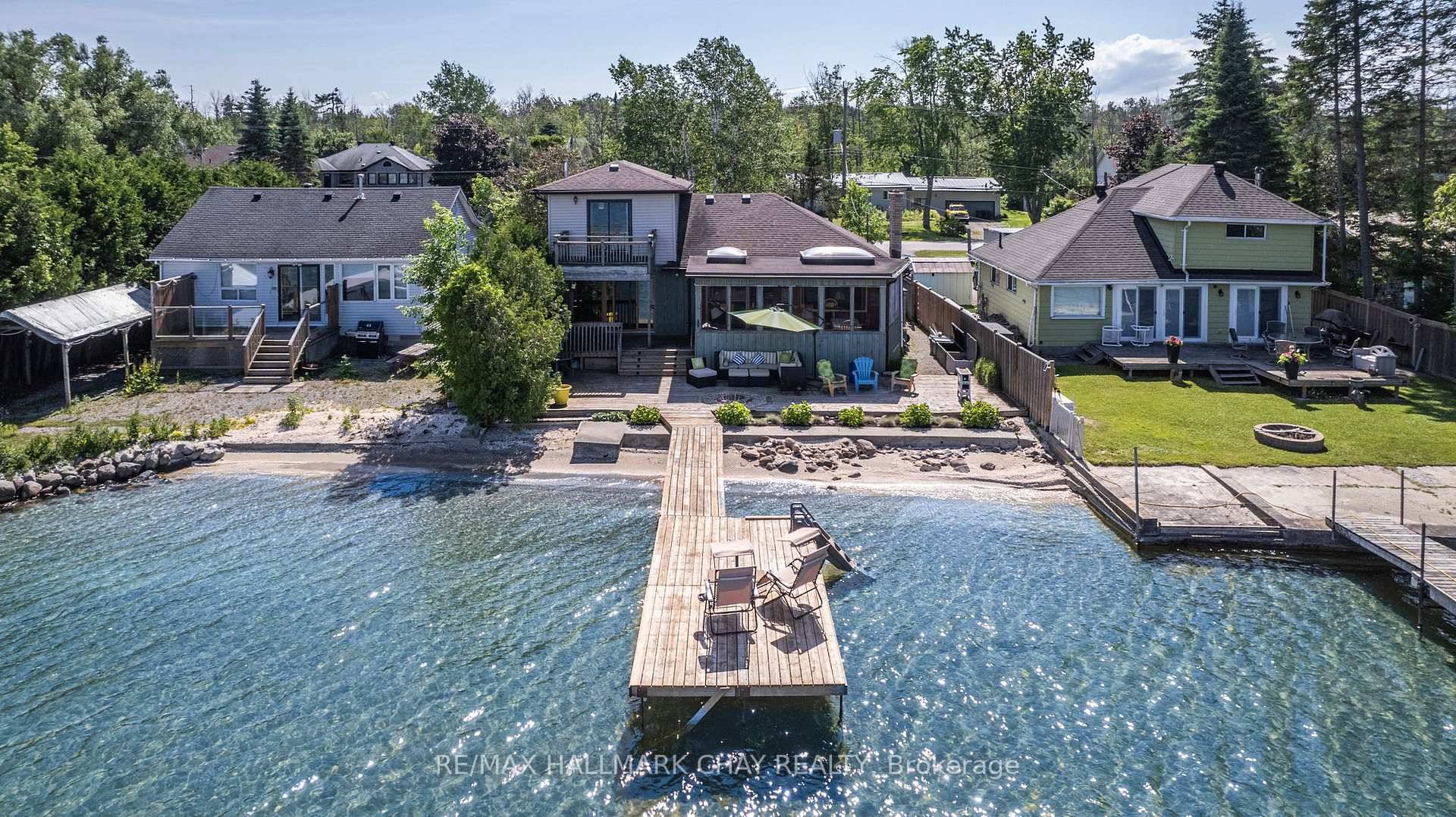This charming 1 storey home offers the perfect blend of comfort, character, and stunning water views with direct access to your own hard sand beach with crystal clear water.