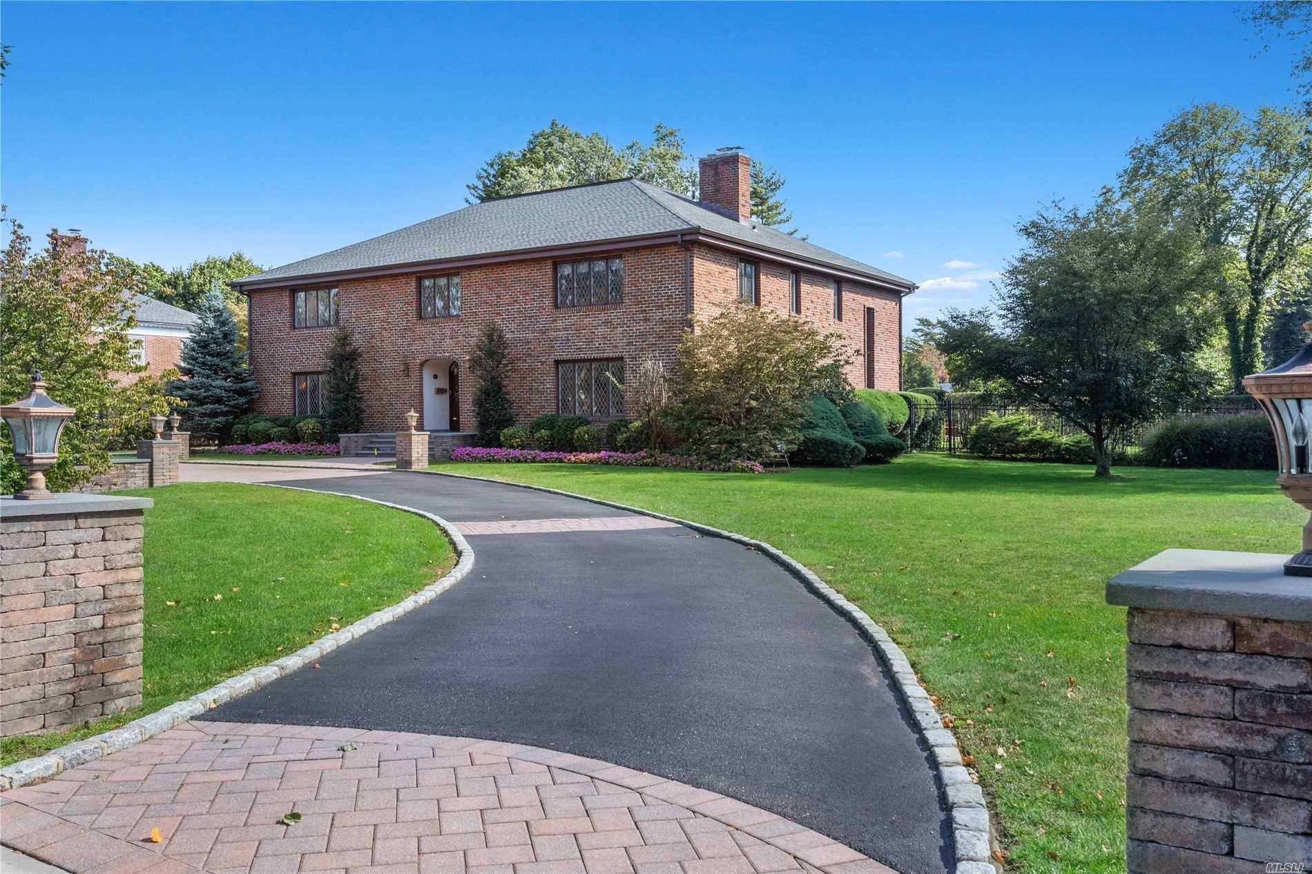 This Grand Center Hall Colonial situated on 1 acre of private resort like grounds with in ground pool, brick patio and custom deck with outdoor kitchen.