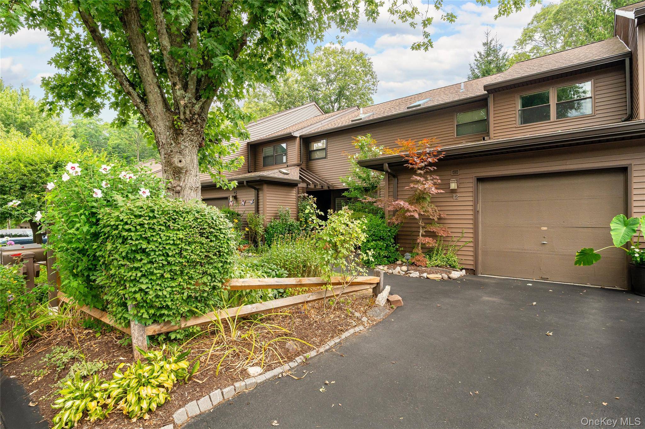 Enjoy relaxing on your private patio overlooking the spectacular gardens of the The Woods, or take a walk on the pathways and find a seat among the flowers.
