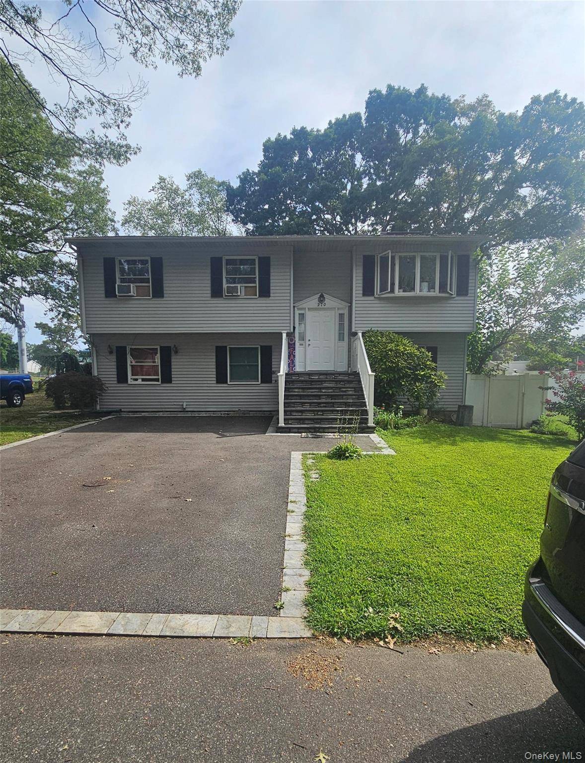 Nice High Ranch with 6 Bedrooms, 2 Full Baths, Livingroom, Dinning room, Cathedral Ceilings, 2 Skylights, parking space up to 7 cars.