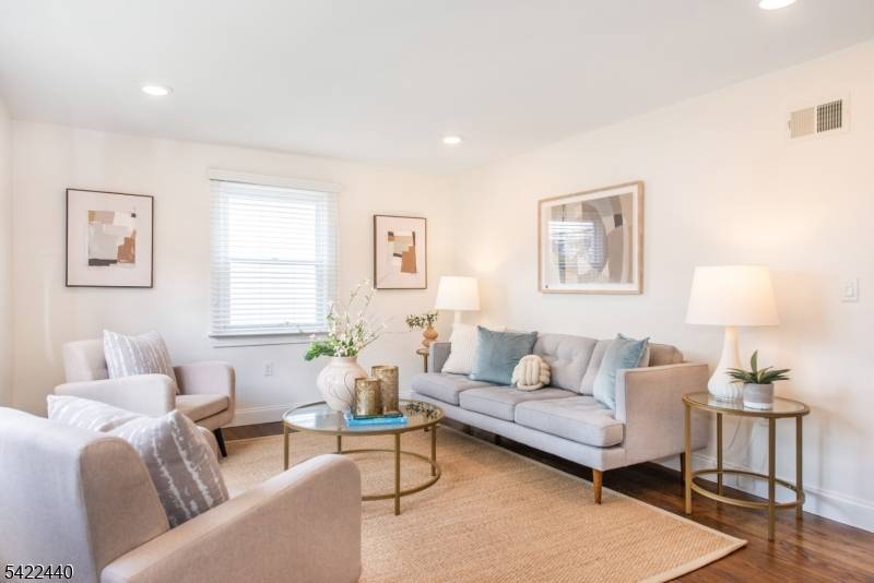 Bright, cheerful, and thoughtfully updated Cape Cod tucked at the end of a friendly no through street where neighbors stroll and bikes roll by.