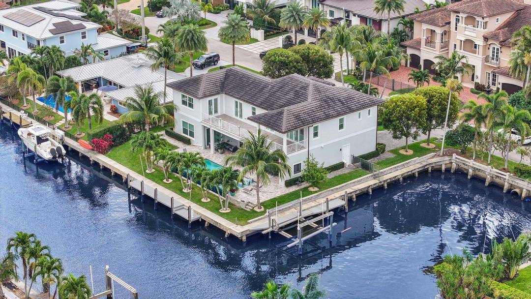 Welcome to 917 Tropic Boulevard, a distinguished residence in the esteemed waterfront community of Tropic Isle, Delray Beach, Florida.