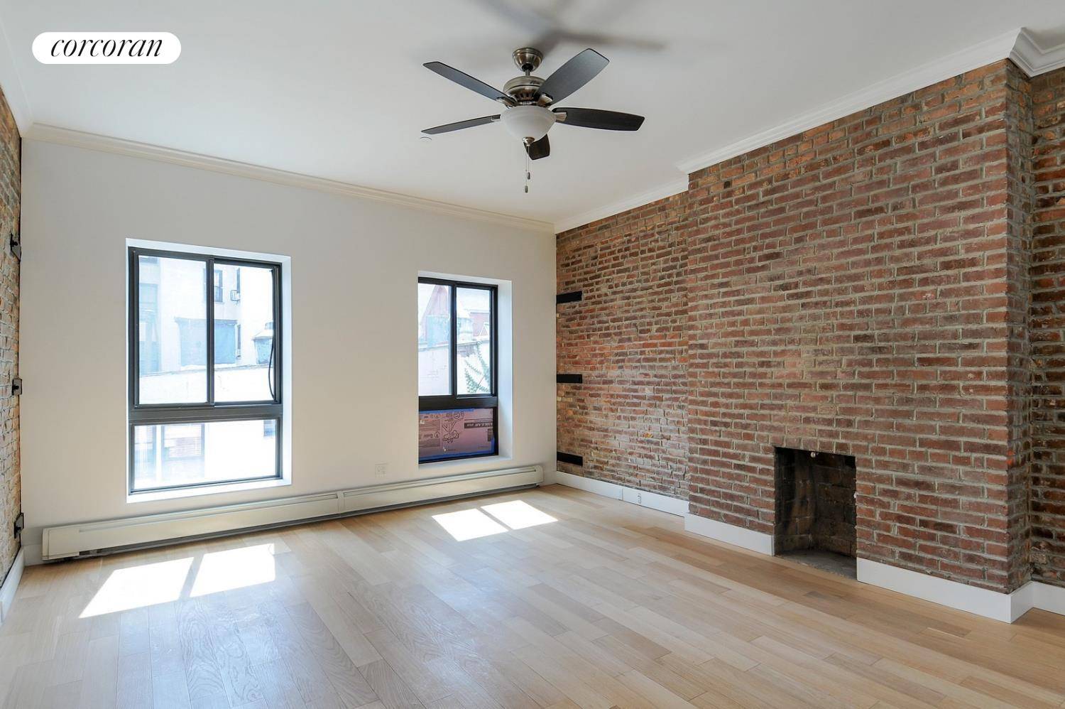 Charming and spacious studio with exposed brick, decorative fireplaces, and soaring ceilings in this recently gut renovated building.