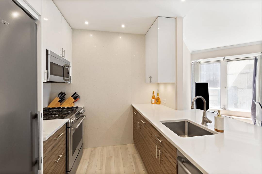 This stunning one bedroom and one and a half bathroom condo with a private balcony is being offered at the CitySpire building in Midtown West.