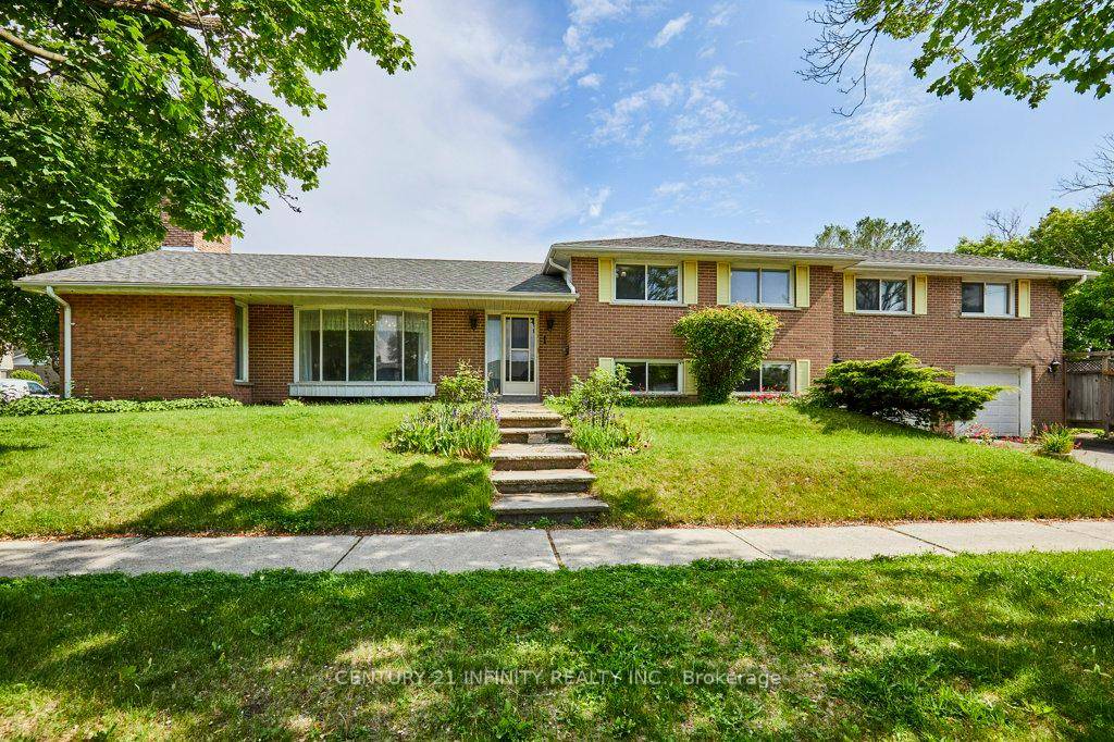 Welcome to 1 Goodland Gate, a custom sidesplit is nestled on an expansive 50' x 150' corner lot.