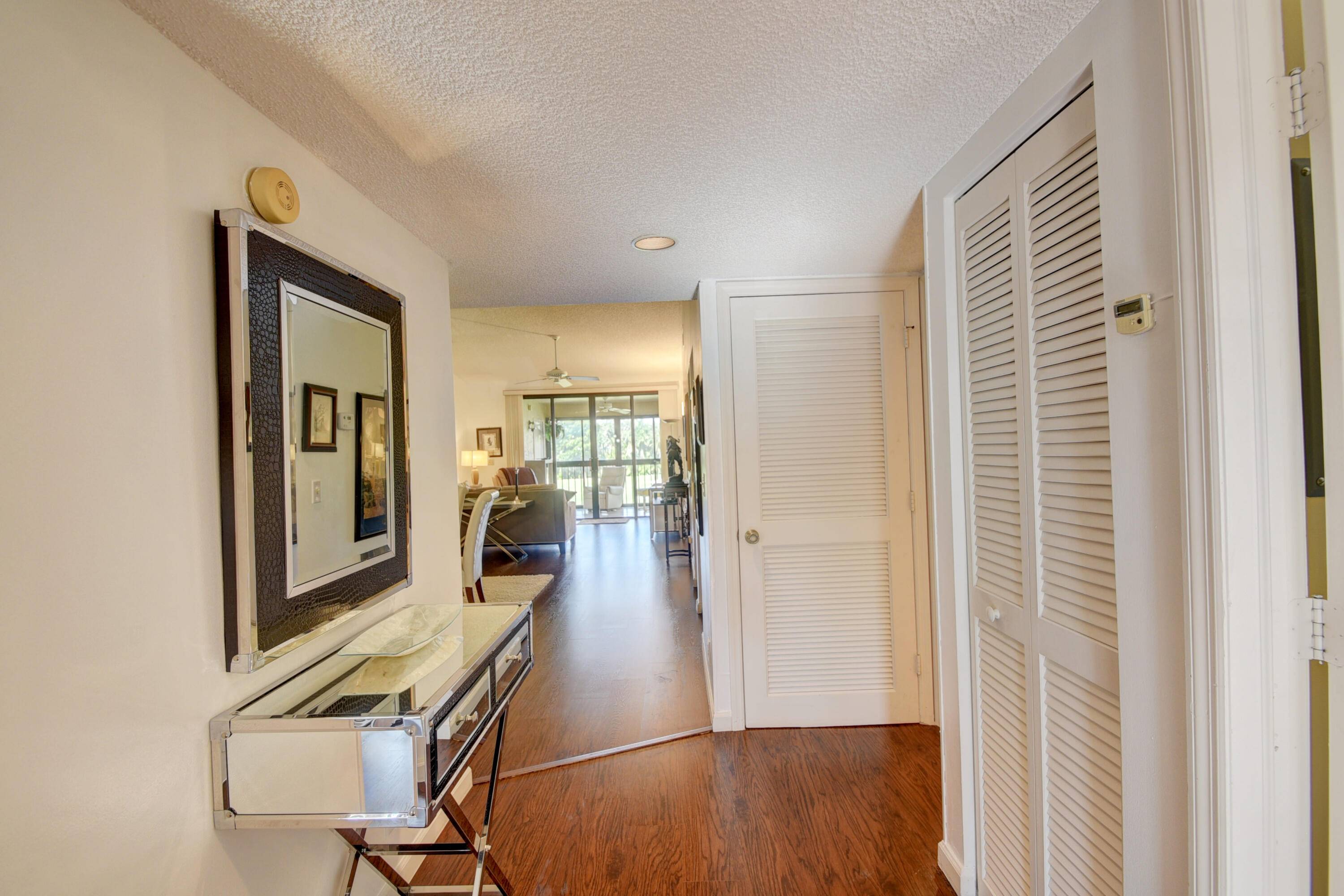 Immaculate, light, bright, 2 bedroom, 2 bath condo overlooking golf course and one short block walk to pool.