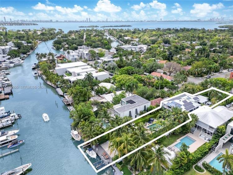 Renovated, elevated, and gated waterfront estate in guard patrolled Belle Meade with direct bay access and no bridges.