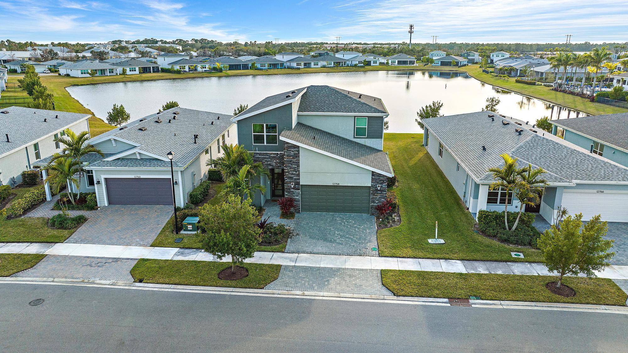Built in 2022 and beautifully sited on a shimmering lake in Emery, this residence pairs refined finishes with everyday ease.