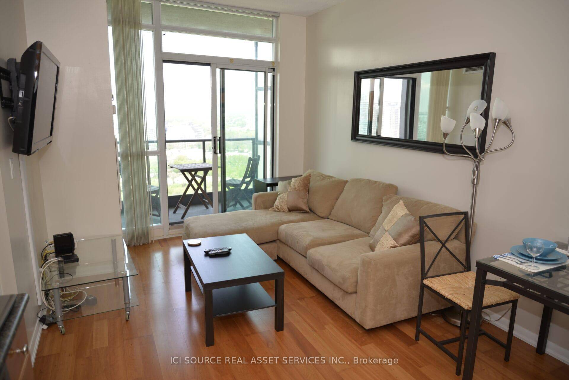 Bright open concept layout with floor to ceiling windows.
