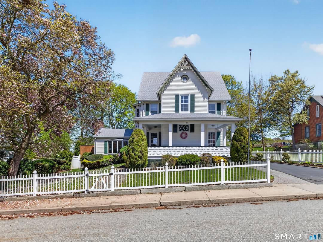 Experience the perfect blend of history, charm, and modern comfort in this beautifully preserved historic home, ideally situated on a picturesque lot just a short stroll from the waterfront.