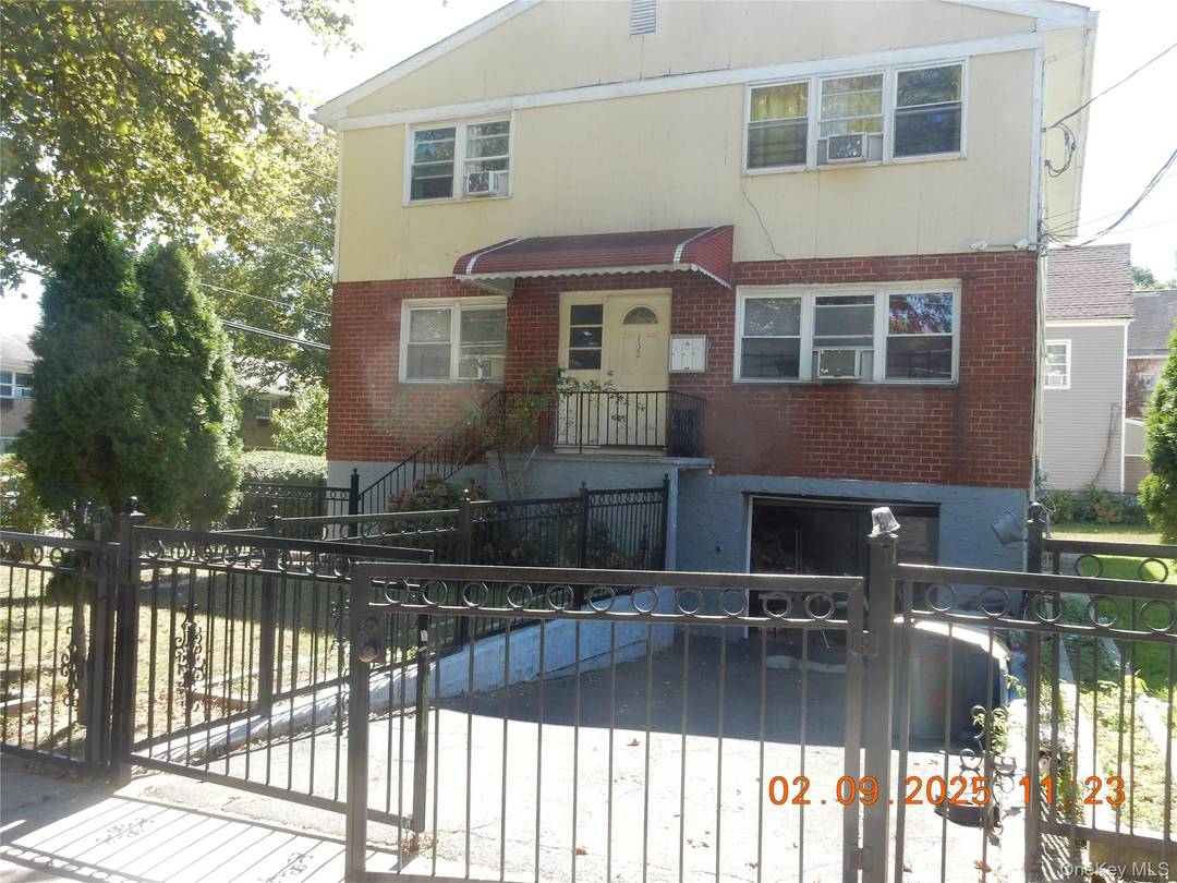 Spacious 2 Family 3 3 Basement sitting corner lot with additional space.