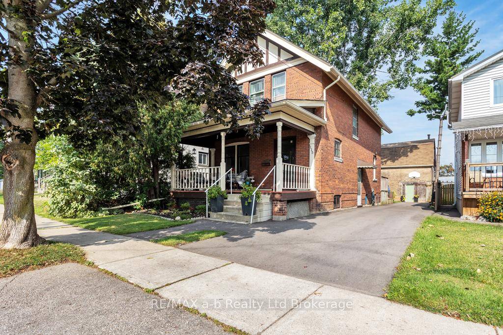 Meticulously maintained century home that features a two story shop sitting on an oversized intown lot.