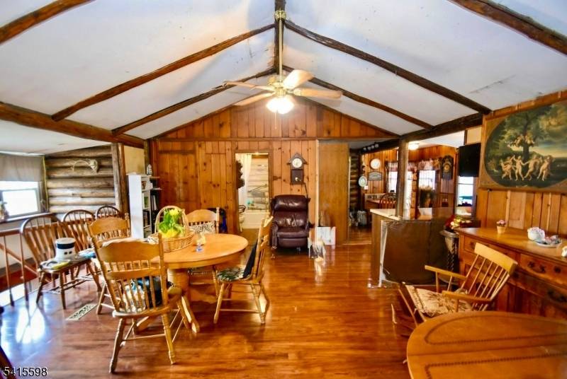 SPECTACULAR 3 BEDROOM 2 FULL BATH 1 CAR GARAGE LOG CABIN NESTLED ON NEARLY ONE ACRE OF PARK LIKE PROPERTY IN THE LAKE STOCKHOLM SECTION OF JEFFERSON TWP.