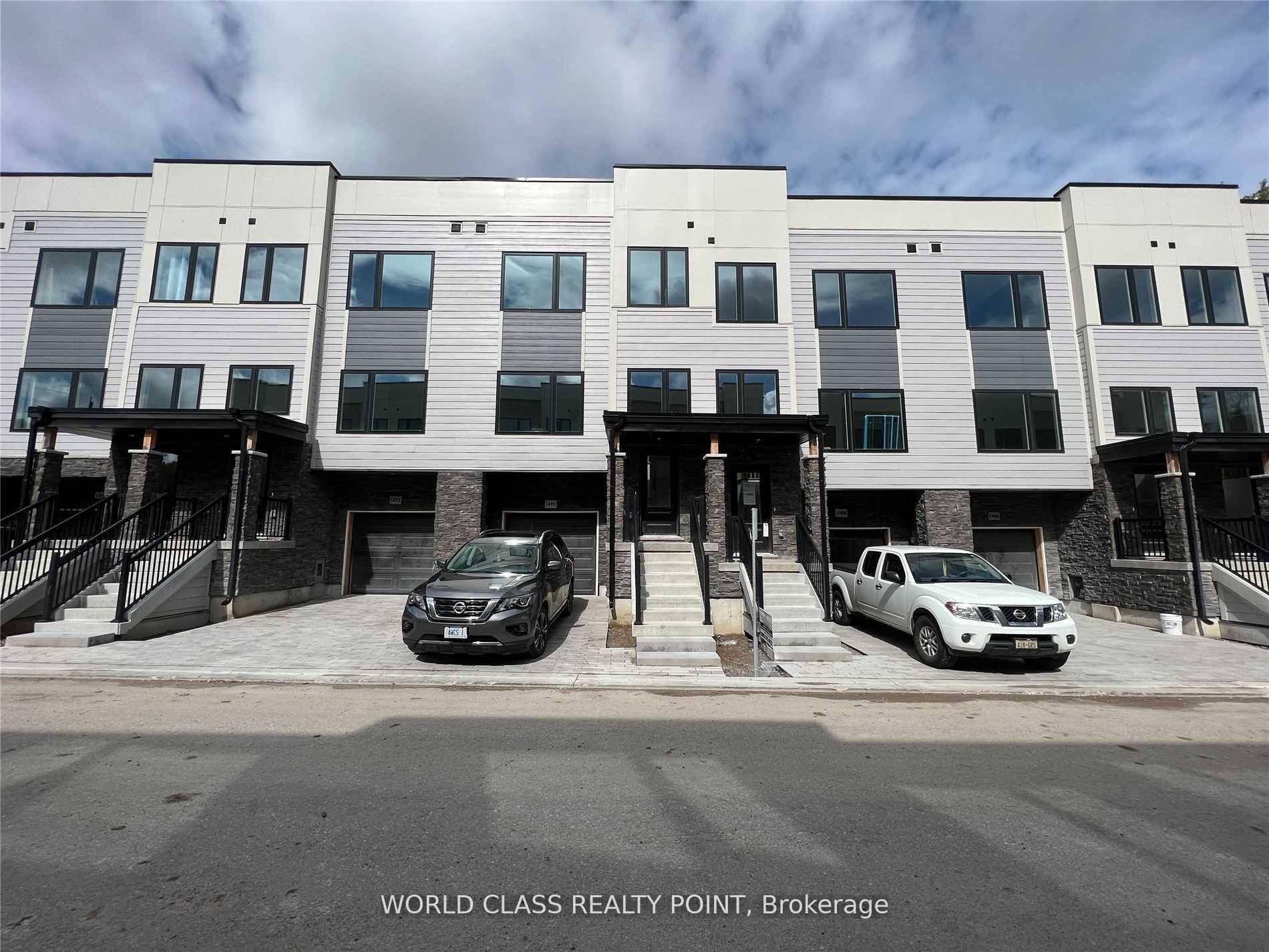 Gorgeous Luxury 3 Year Old 3 Bed 3 Bath Townhouse with Finished Walk out Basement with Direct Access To Garage and Two Parking with Tons of Upgrades.