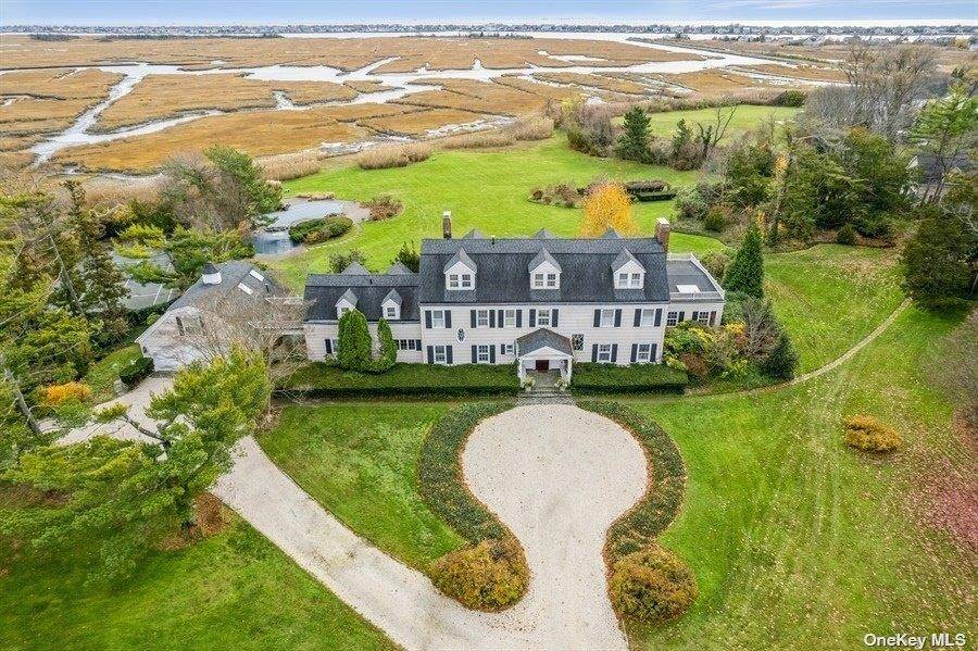 Located on a quiet cul de sac, this magnificent waterfront estate includes a 10, 000 sf Colonial style house on 2.