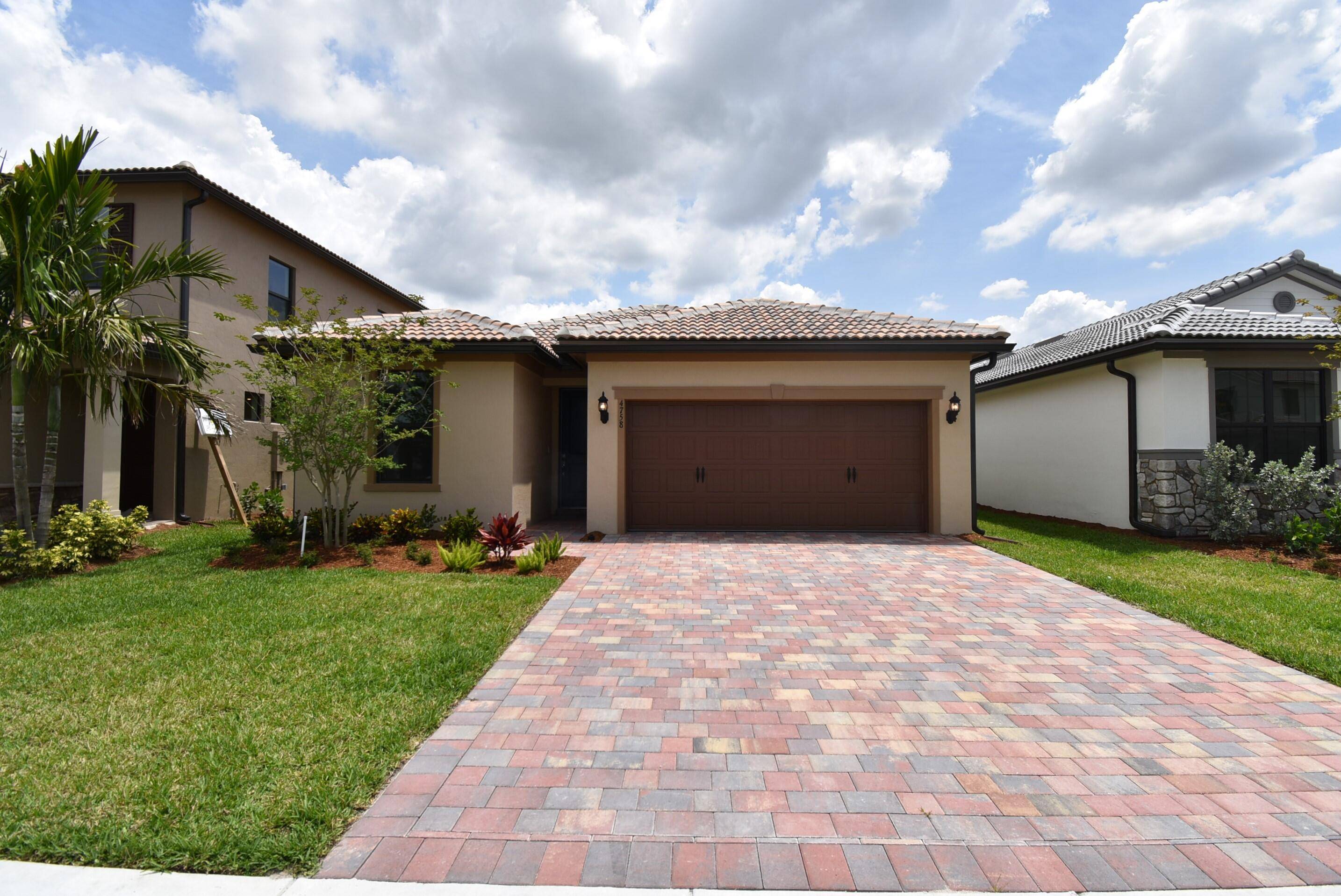 Discover luxury living in The Fields, a gated community in western Lake Worth.