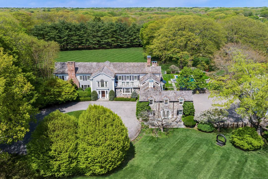 Welcome to 384 West Lane, an exceptional Estate Property that defines timeless Connecticut luxury across 13 exquisite, park like acres straddling Westchester County just an hour from NYC.
