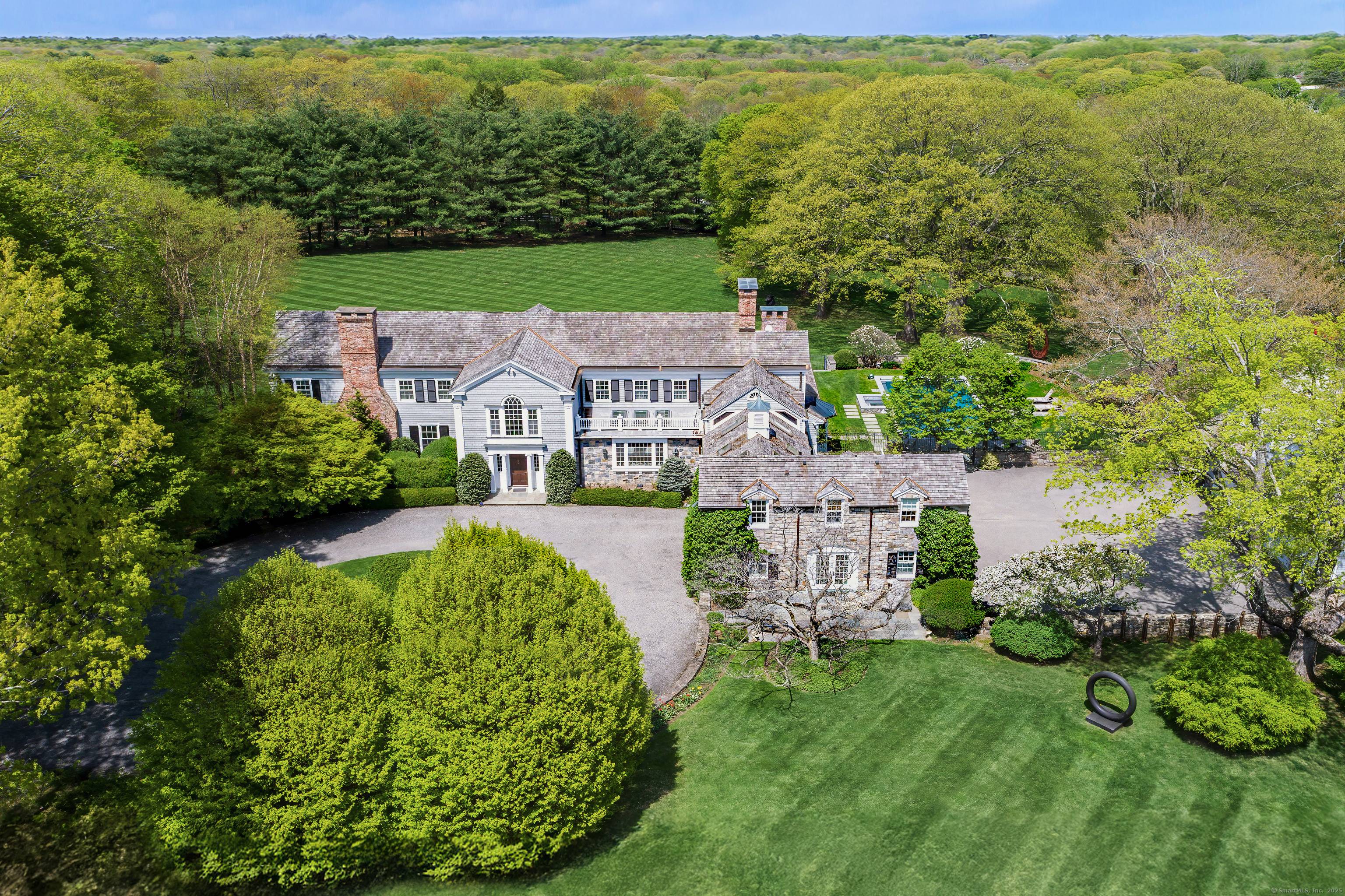 Welcome to 384 West Lane, an exceptional Estate Property that defines timeless Connecticut luxury across 13 exquisite, park like acres straddling Westchester County just an hour from NYC.