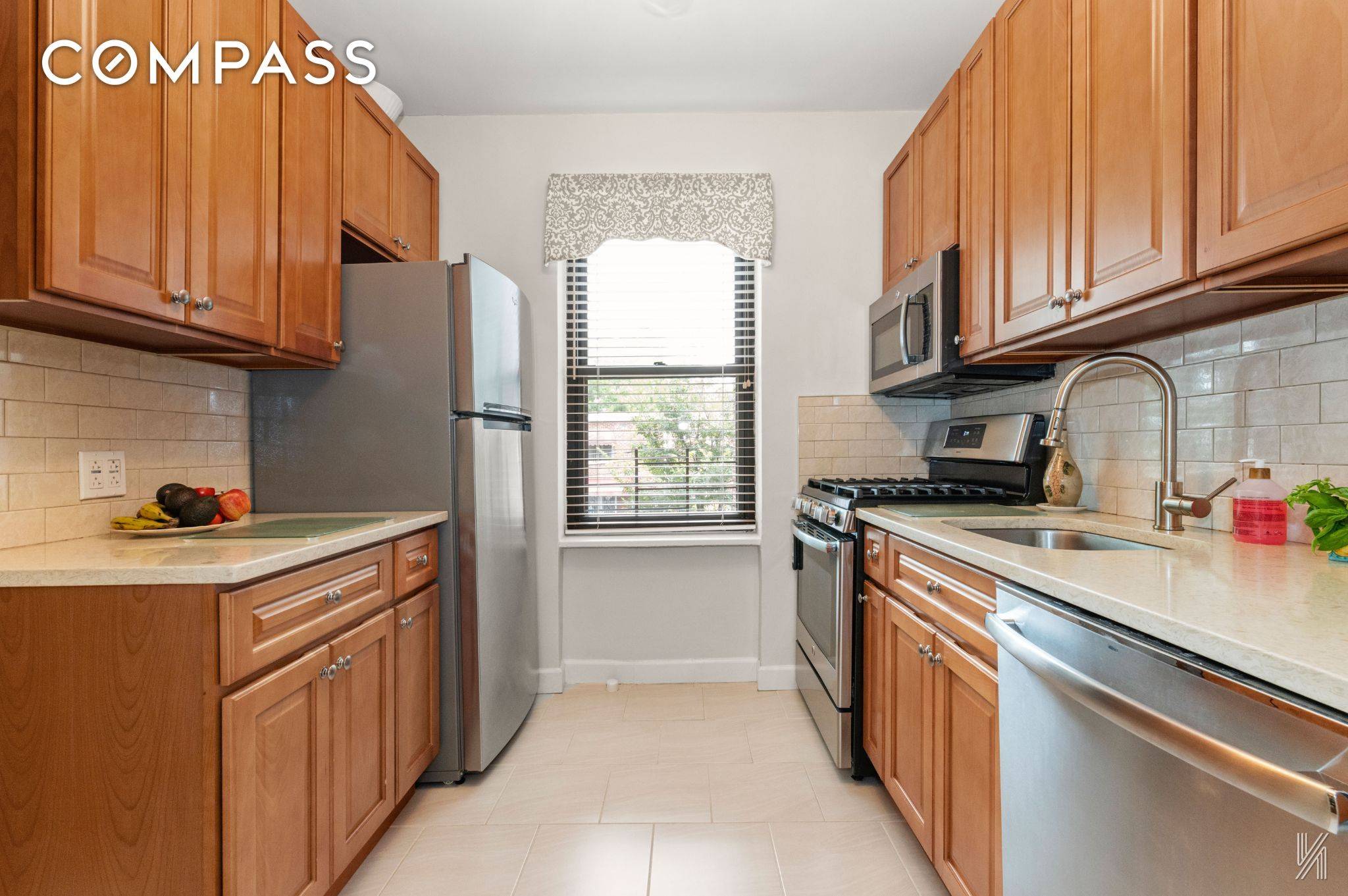This impressive second floor unit features clean white paint and subtly arched entryways.