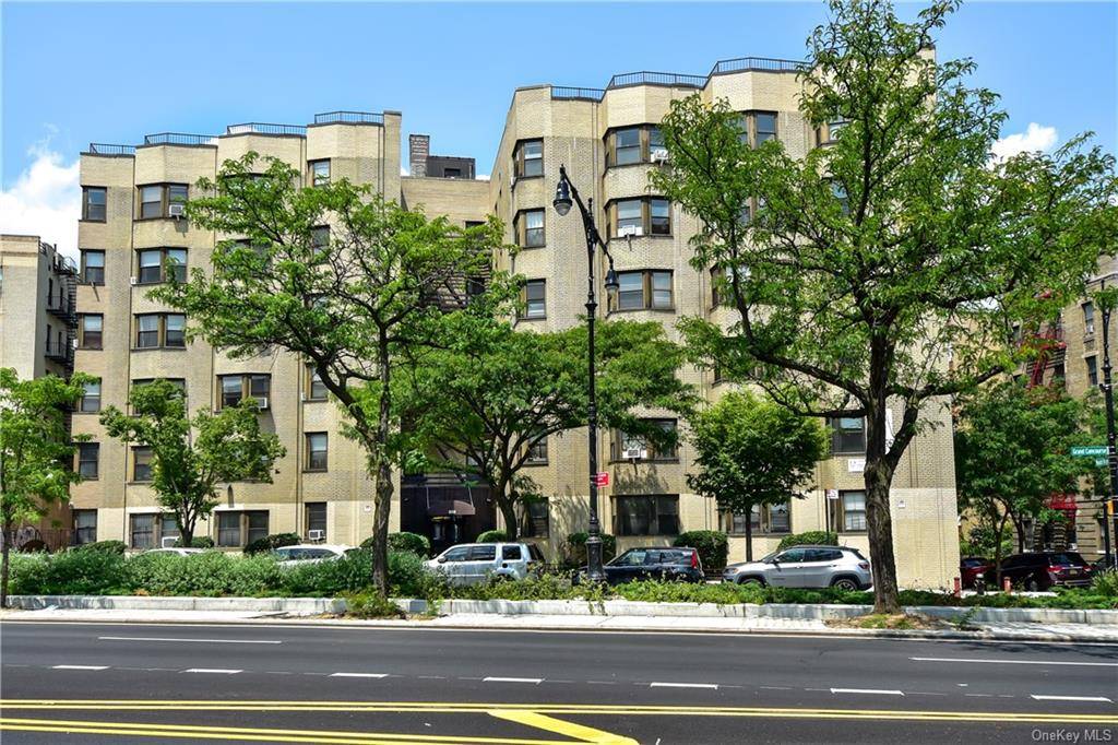 Penthouse level two bedroom Art Deco co operative for sale with views of tree lined Grand Concourse only two blocks from D train Tremont Ave stop.