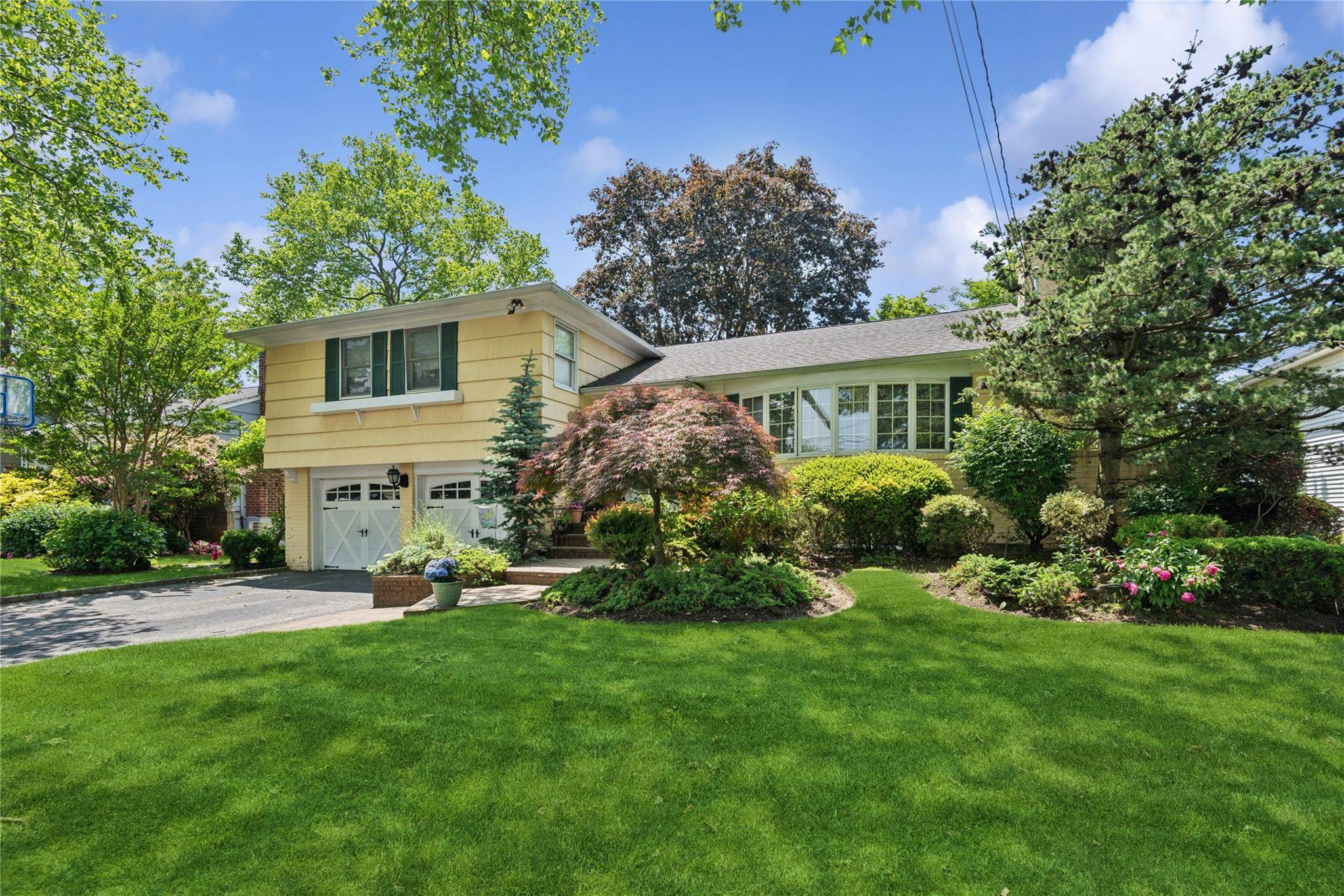 Welcome To This Beautiful Split Level Home, Where Contemporary Style Meets Timeless Charm.