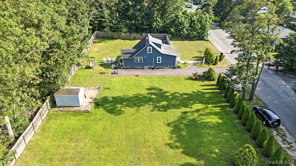 Charming Move In Ready Home in a huge lot on a quiet, private street in Farmingville, NY.