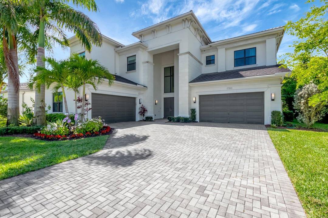 You can enjoy all that Boca Bridges has to offer from this lakeside estate.