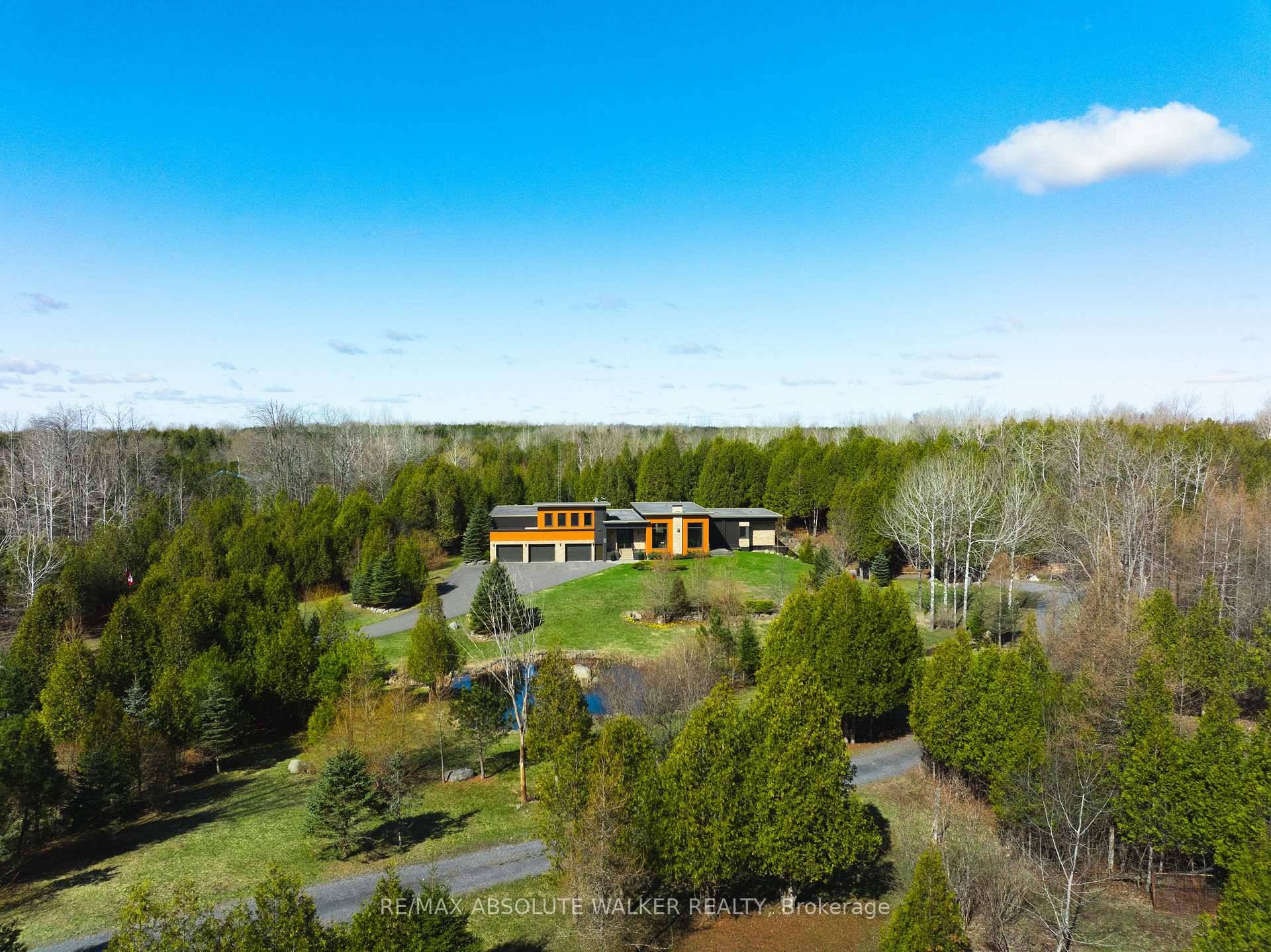 Welcome to 19421 Kenyon Concession 1, an architecturally distinctive home built in 2013 that seamlessly blends modern craftsmanship with natural beauty.