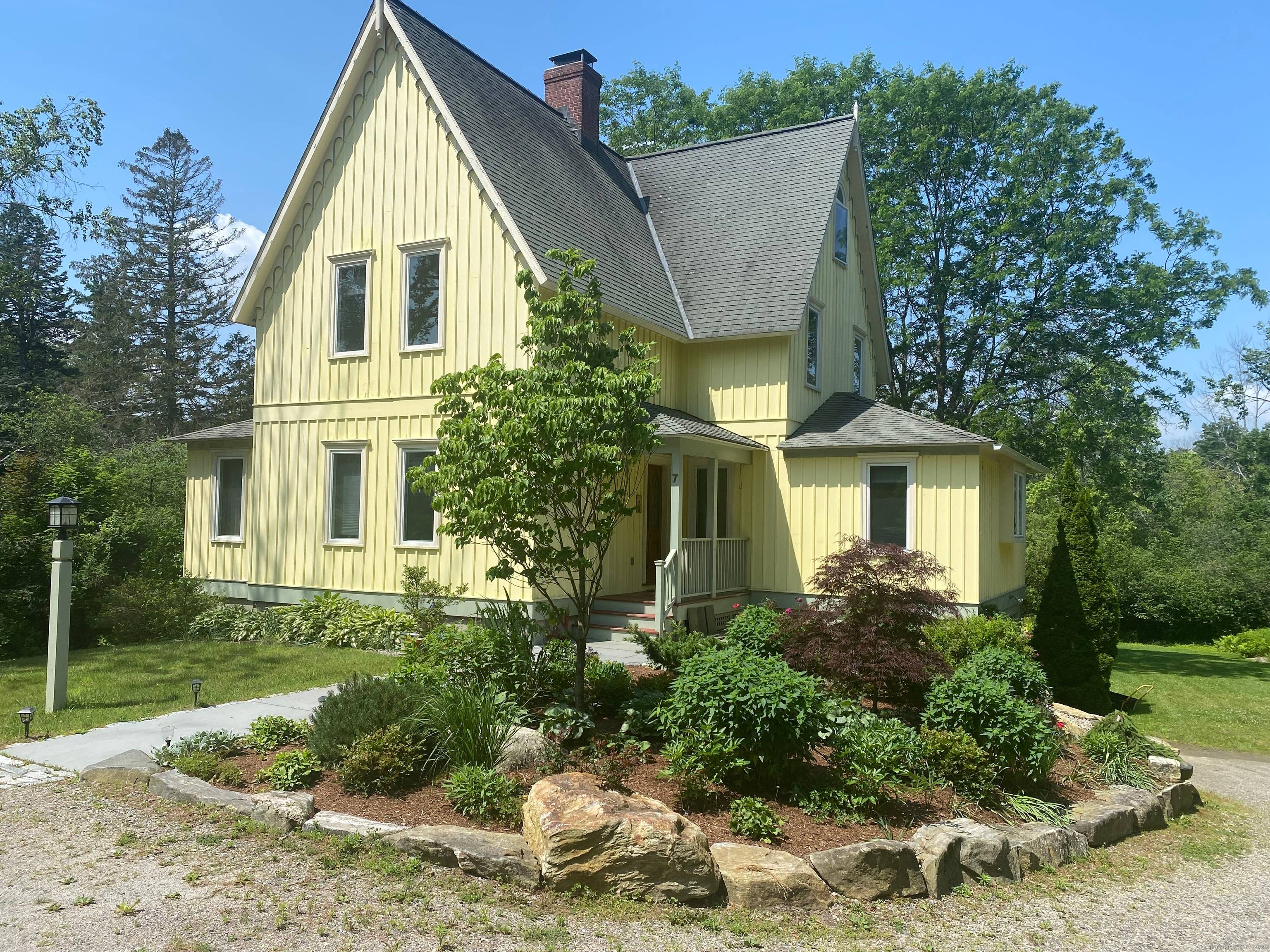 BEACON Cottage is a rare board and batten, Carpenter Gothic Modern Victorian.