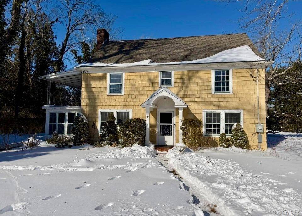 This timeless Westhampton Beach Village Colonial is set on.